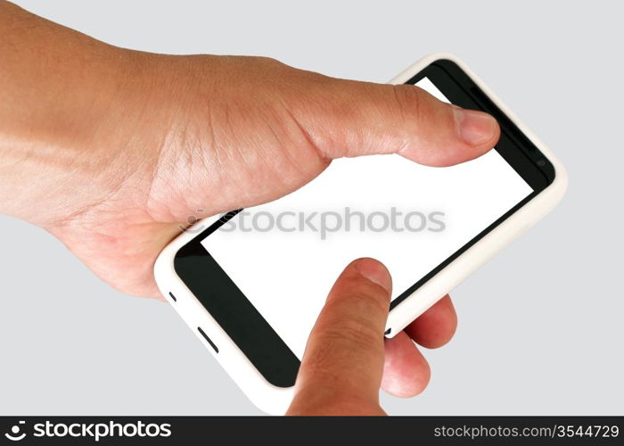 Mobile phone in a man&acute;s hand. Isolated on a grey background.