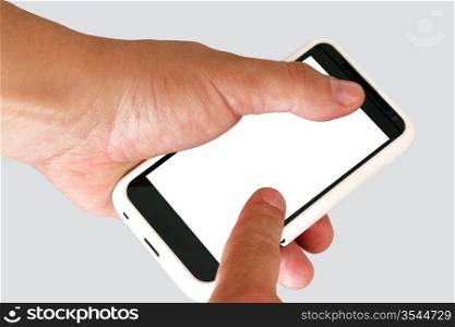 Mobile phone in a man&acute;s hand. Isolated on a grey background.