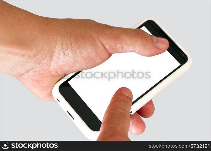 Mobile phone in a man&rsquo;s hand. Isolated on a grey background.