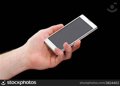 Mobile phone in hand isolated on black background