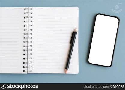 Mobile phone with blank on screen , note papers and pen isolated on gray background, for template, mock up, topview, flat lay, communication technology