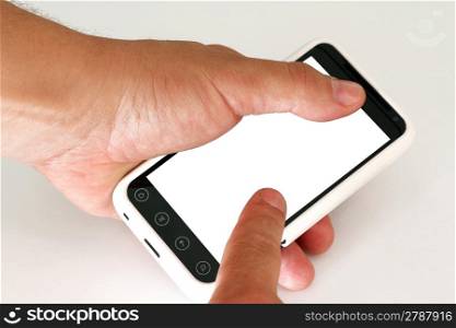 Mobile phone with blank screen in a man&acute;s hand.