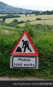 Mobile road works sign on a rural lane