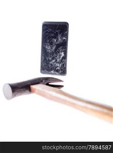 Mobile smartphone with broken screen with hammer next to it isolated on white.