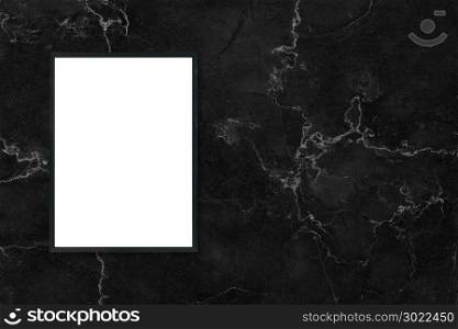 Mock up blank poster picture frame hanging on black marble wall background in room - can be used mockup for montage products display and design key visual layout.