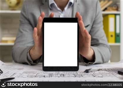 mock up businessman holding tablet