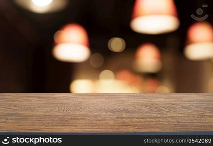 Mock up for space. Empty dark wooden table in front of abstract blurred bokeh background of restaurant . can be used for display or montage your product.