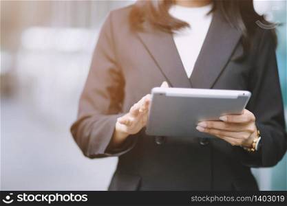 Mock up of a woman holding digital tablet device in hands. Clipping path