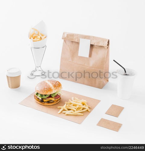 mock up set burger french fries parcel disposal cup white surface