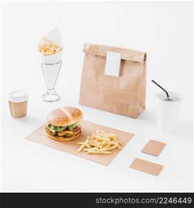 mock up set burger french fries parcel disposal cup white surface