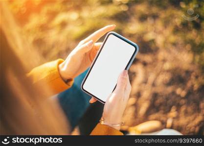 Mockup of a woman with her phone at sunset