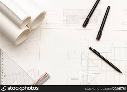 Mockup of architectural concept, Drawing tool and engineer drawing on blueprint with roll blueprint.