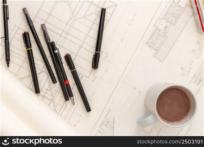Mockup of architectural concept, Drawing tools and hot coffee on engineer drawing of blueprint.