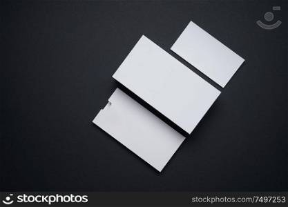 Mockup of blank square white box,card and catalog isolated on black background for your design