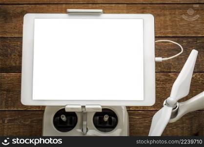 mockup of digital tablet with a blank isolated screen  clipping path included  mounted on a drone radio controller