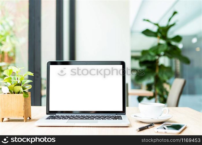 Mockup of laptop computer with empty screen with coffee cup on table of the coffee shop background,White screen