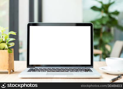 Mockup of laptop computer with empty screen with coffee cup on table of the coffee shop background,White screen