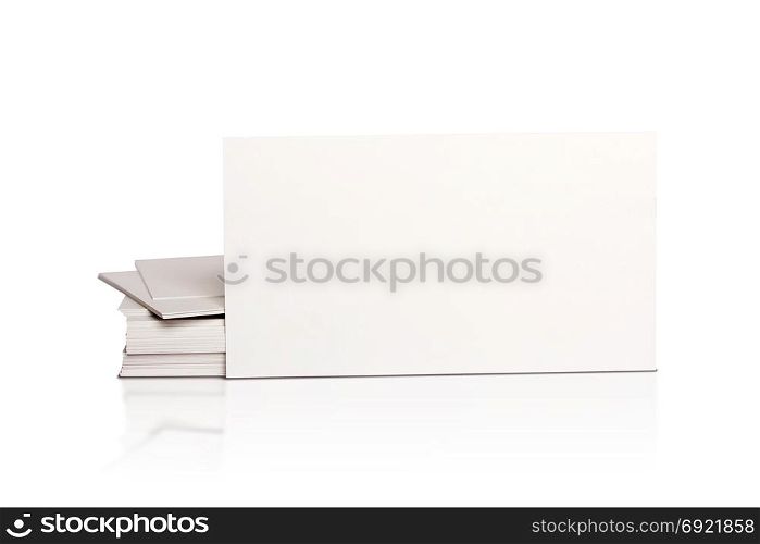 Mockup pile of blank white business cards isolated on white background