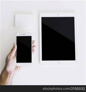 mockup with hand holding smartphone tablet