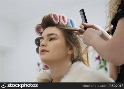 Model Having Hair Put in Curlers