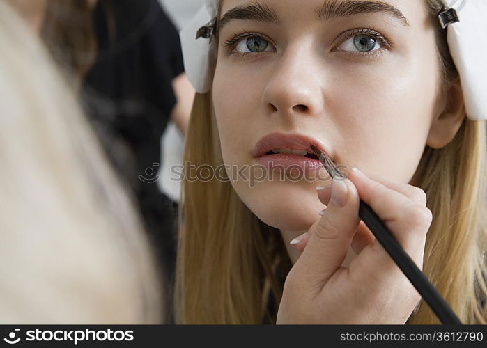 Model Having Makeup Applied