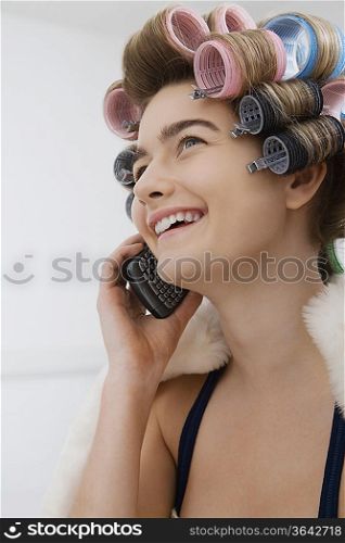 Model in Curlers Talking on Cell Phone