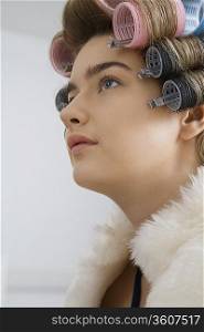Model in Hair Curlers Wearing Fur Coat