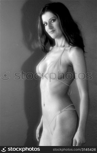 Model in Shiny Bikini, Sexy body, Sweaty body, Figure wet and oily, strong expression, sensual, sexy, shot in studio .Melbourne ( MR )