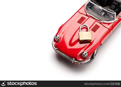 Model of a red car with padlock on white background, view from above. Concept of security. Close up, copy space.