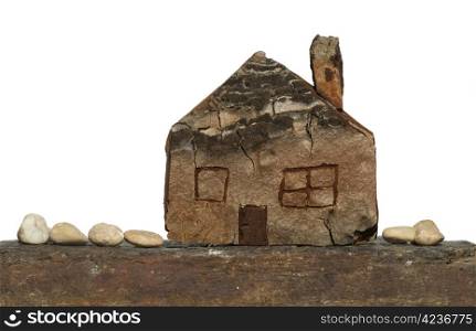 Model of a small wooden house. White isolated