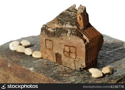 Model of a small wooden house. White isolated