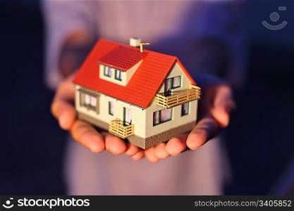 model of house on hands