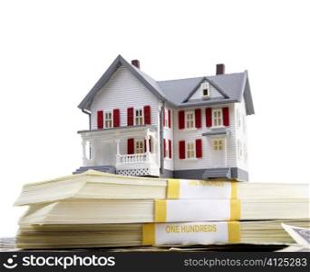 model of the house and us dollars on white background, selective focus, finance or rental concept