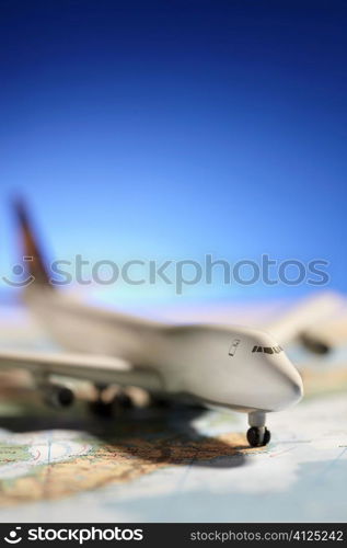 model on map, selective focus on nearest part of aircraft,