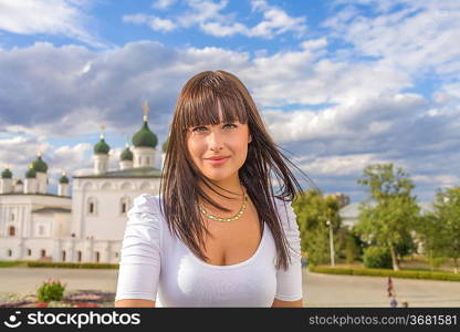 model posing in front of tall building