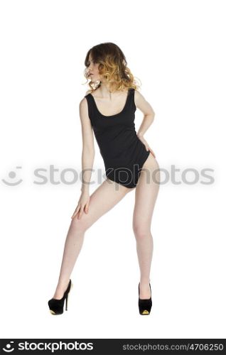 Model tests, Young slim woman posing in black leotard, isolated on white