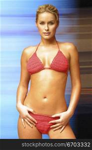 Model wearing Red Bikini standing confidently. Incredible Skin. Shot Melbourne August 2002. .