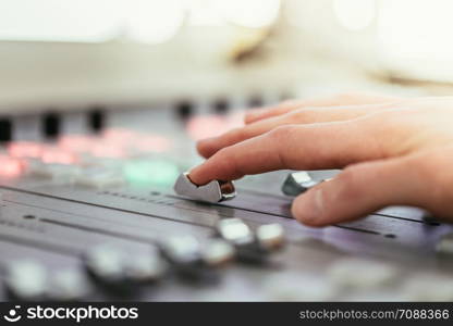 Moderator and soundboard in radio broadcasting studio