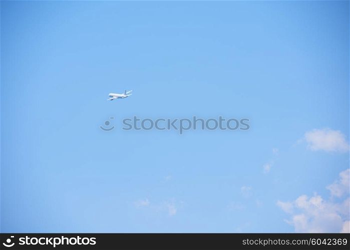 modern airplane travel, clear blue sky in background