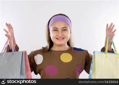 Modern and happy little girl with shopping bags