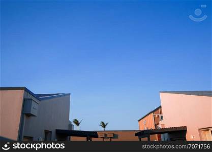 Modern and minimal residential building with light and shadow, summer background