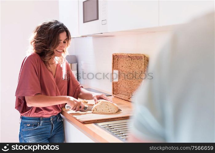 Modern and young couple cooking together at home
