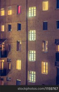 Modern apartment block at dusk, urban city life