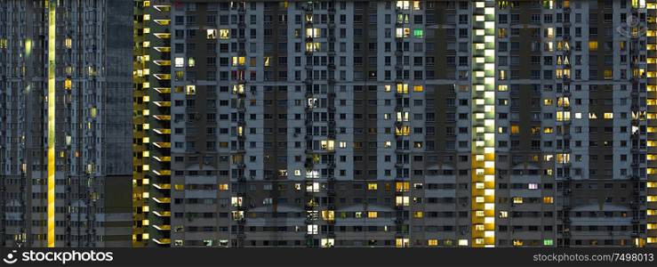 Modern apartment buildings on night . Facade of a modern apartment building .
