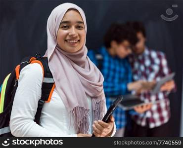 Modern Arab teens use smartphones, tablets, and laptops to study during online classes due to corona virus pandemic. High quality photo. Modern arab teens use smartphone, tablet and latpop to study during online classes due to corona virus pandemic