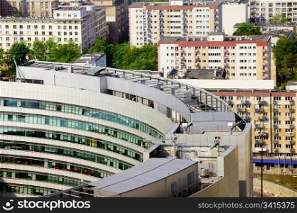 Modern architecture of round office building and block of flats in the city center of Warsaw, Poland