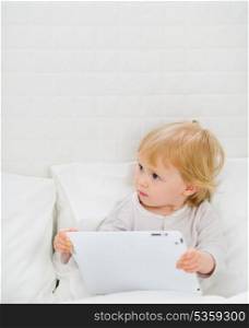 Modern baby with tablet PC