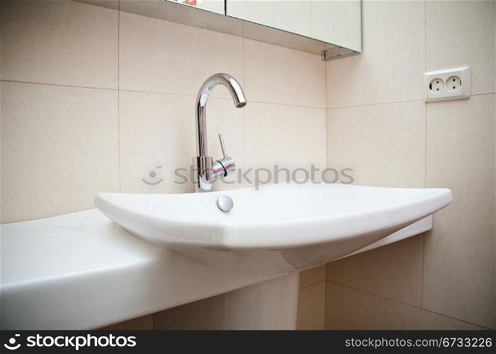 Modern bathroom sink in white ceramic