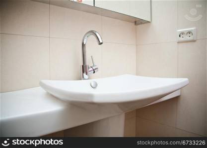 Modern bathroom sink in white ceramic