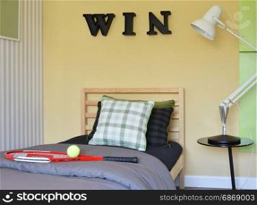 modern bedroom interior decorative with racquet and tennis ball on wooden bed